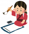 書き初めをする女の子