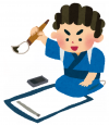 書き初めをする男の子
